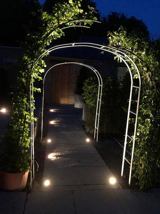 Cotswolds hotel garden arch lighting