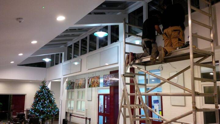 Ceiling mounted infrared panels in a shop
